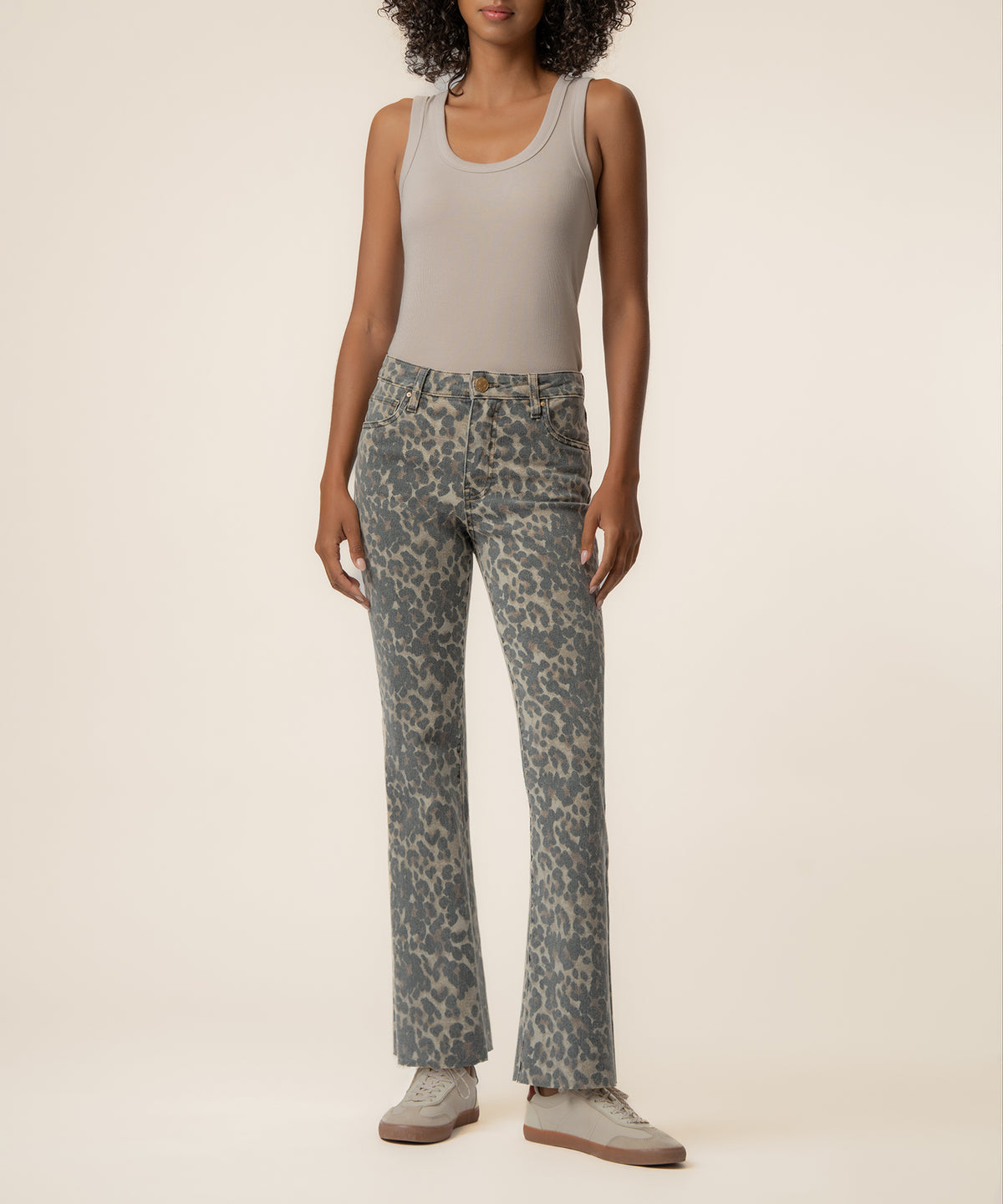 Tan and brown leopard print high-rise ankle flare jeans with a fitted waistband and flared leg.