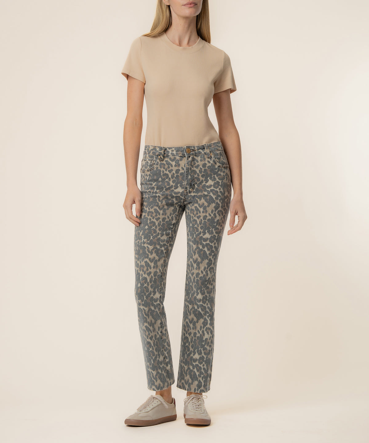 Tan t-shirt paired with leopard print high-rise flare jeans in gray and tan.