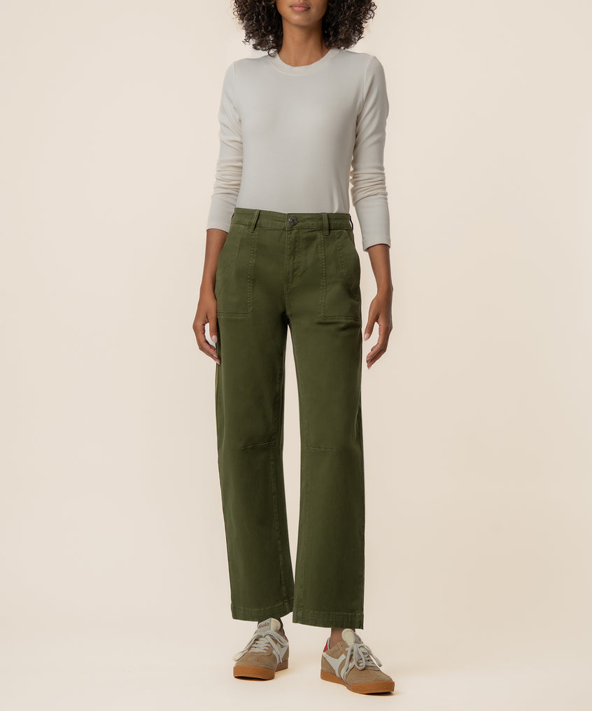 Wide-leg barrel pants in olive green with patch pockets, styled with a cream long-sleeve top.