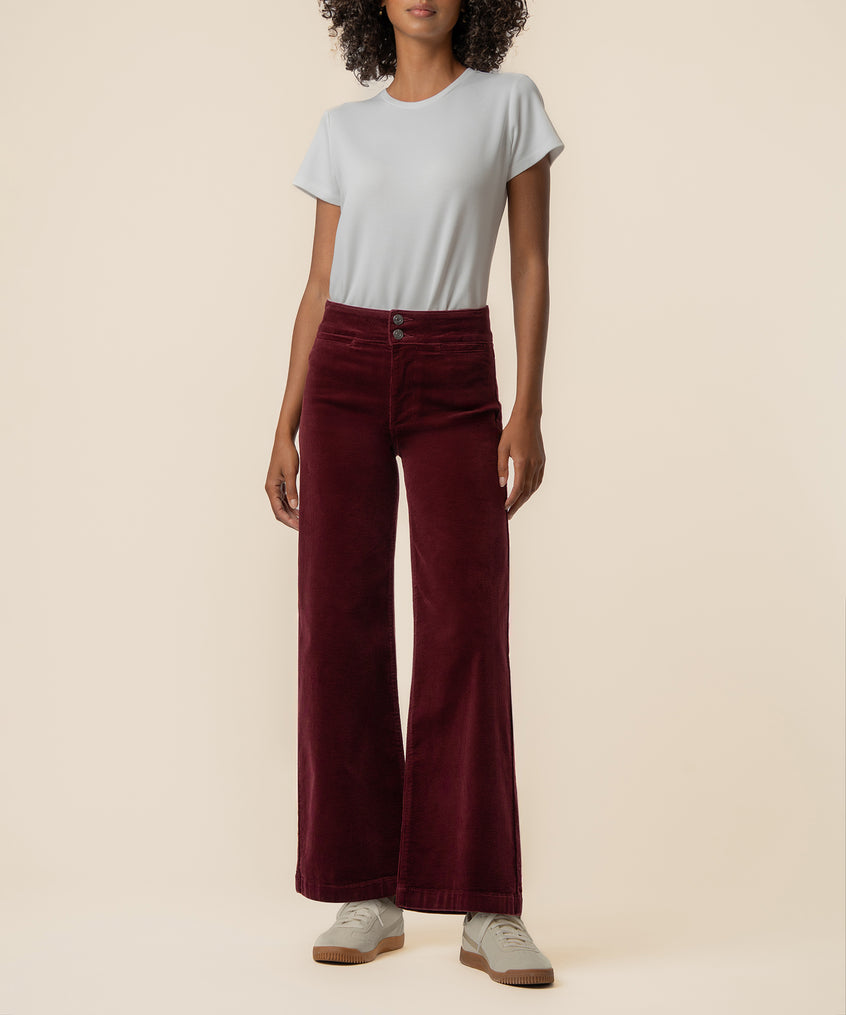 Dark cherry corduroy wide-leg pants with high waist and two-button closure, styled with light gray t-shirt.
