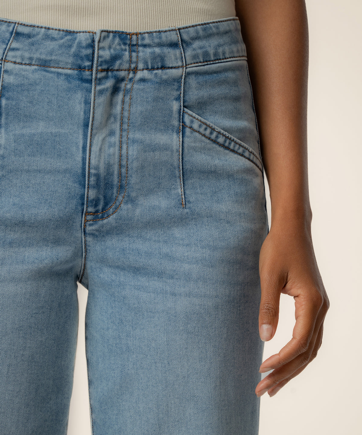 Light wash high-rise straight leg jeans with zip fly and classic five-pocket styling.