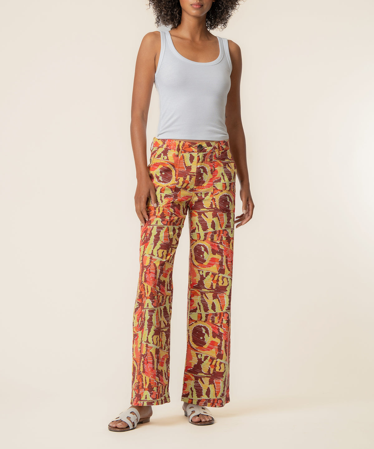High-waist straight-leg linen pants in wine and yellow abstract print pattern.