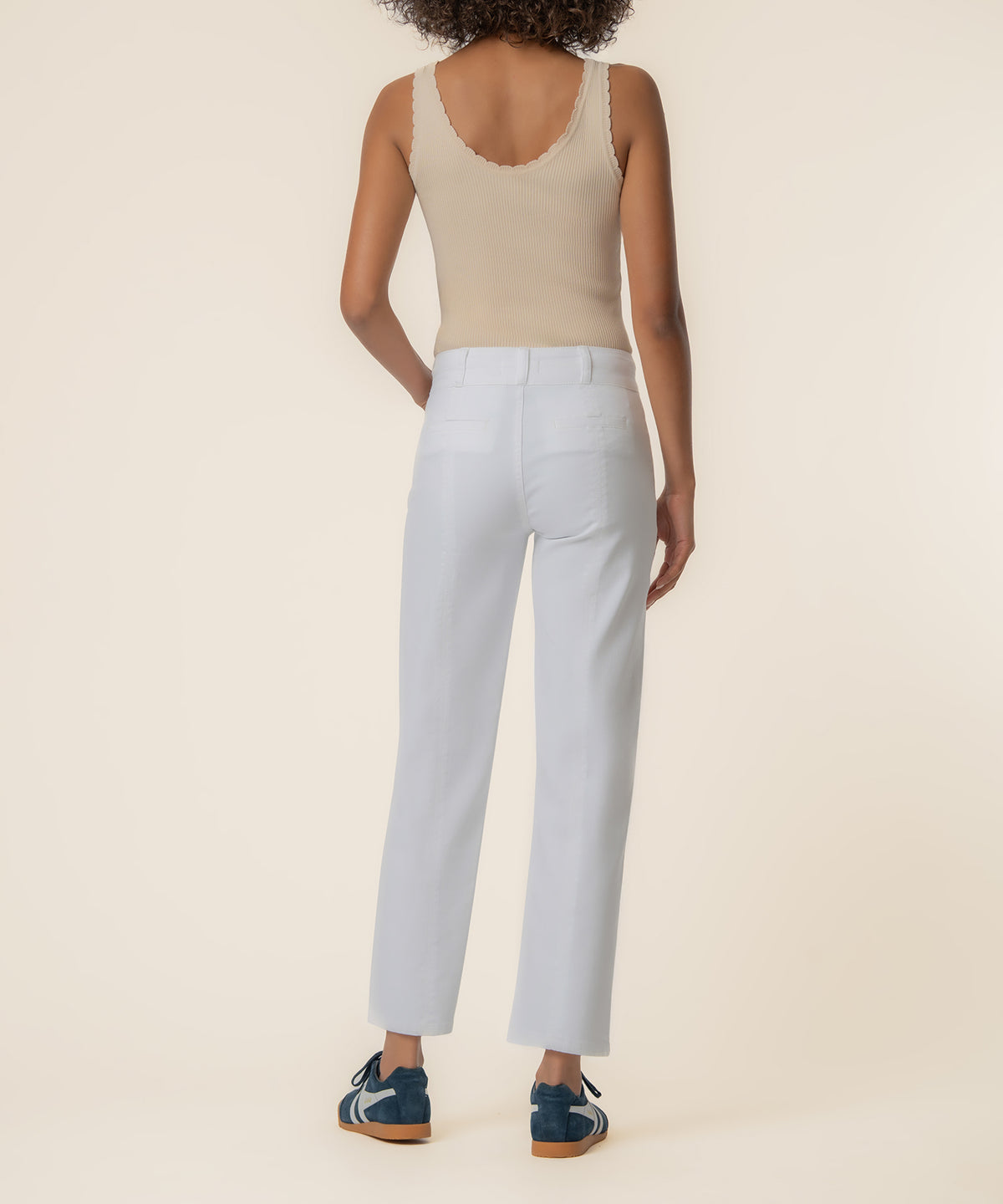White high-rise straight-leg jeans with a cropped inseam, shown from back view on a model.