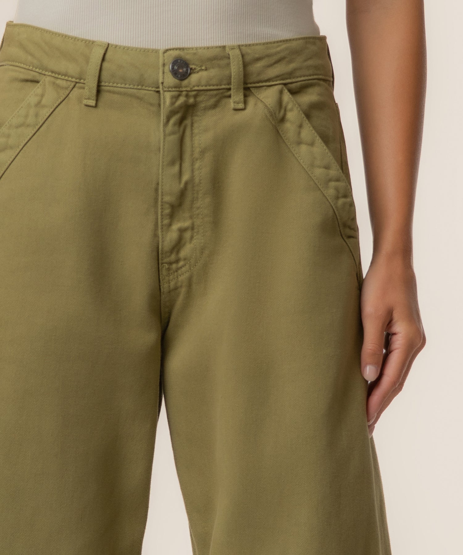 Olive-green high-rise trouser with relaxed leg silhouette, button closure, and curved front seam detail.