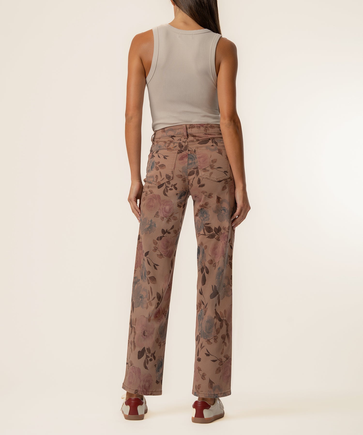 Mauve twill high-rise wide-leg pants with floral print, shown from back on model wearing neutral sleeveless top.