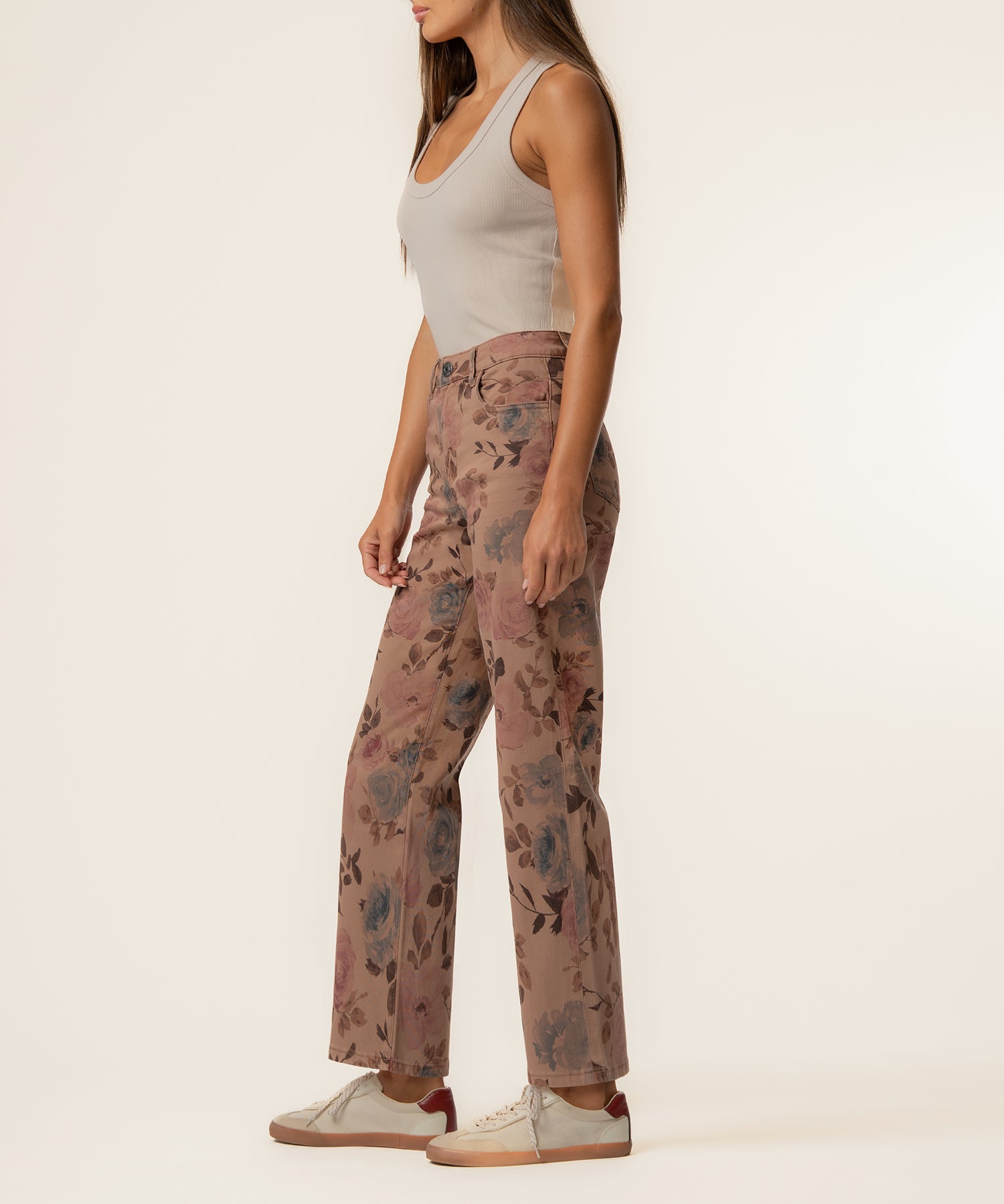Mauve twill pants with floral print, high rise wide leg cut, shown on model with white tank top.