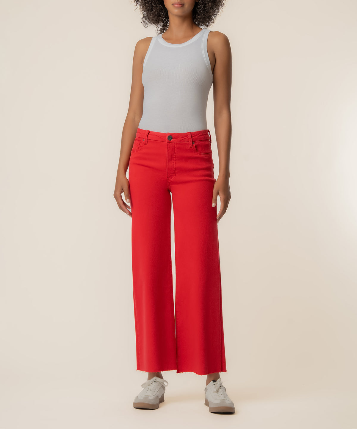 Red high-rise wide-leg jeans with button closure and five-pocket styling.
