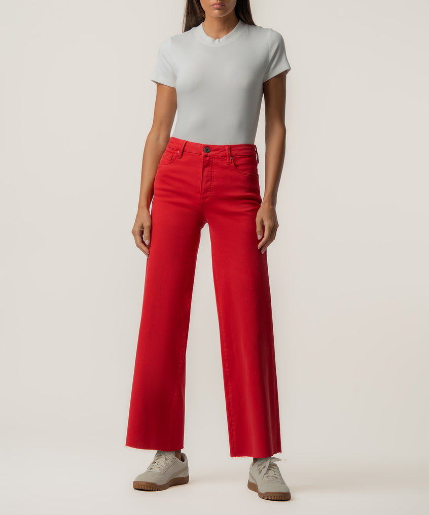 Scarlet red high-rise wide-leg jeans with a cropped length, paired with a white t-shirt.
