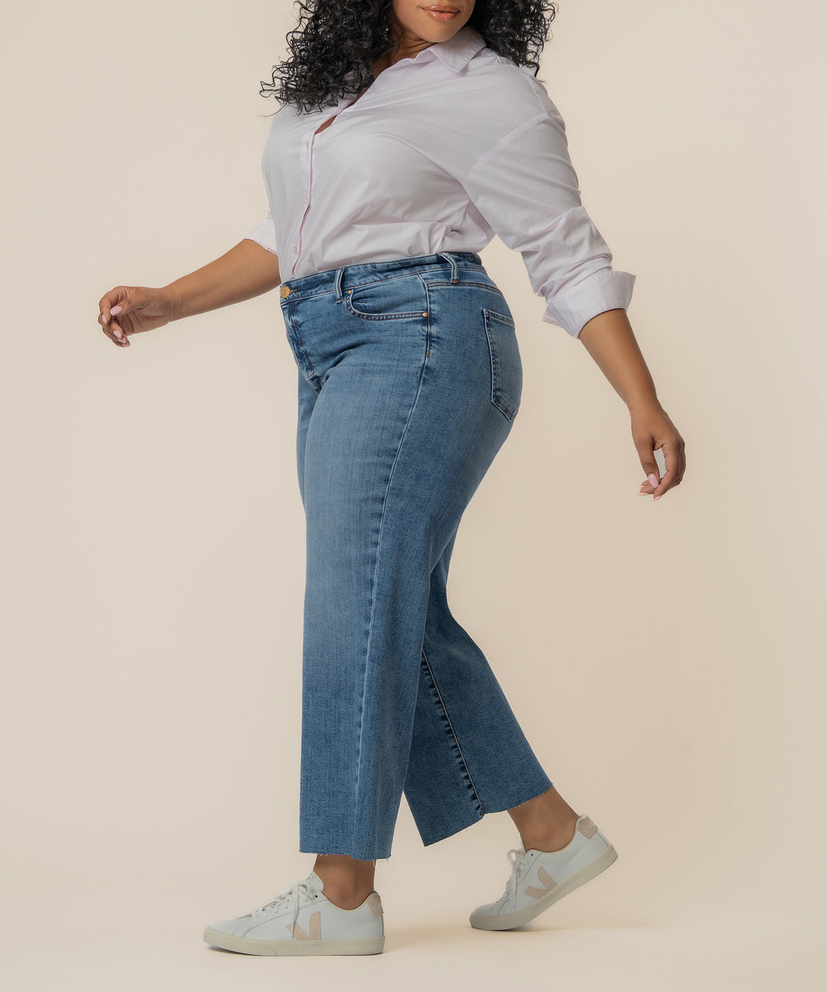 High-rise wide-leg jeans in medium blue star wash with cropped length.