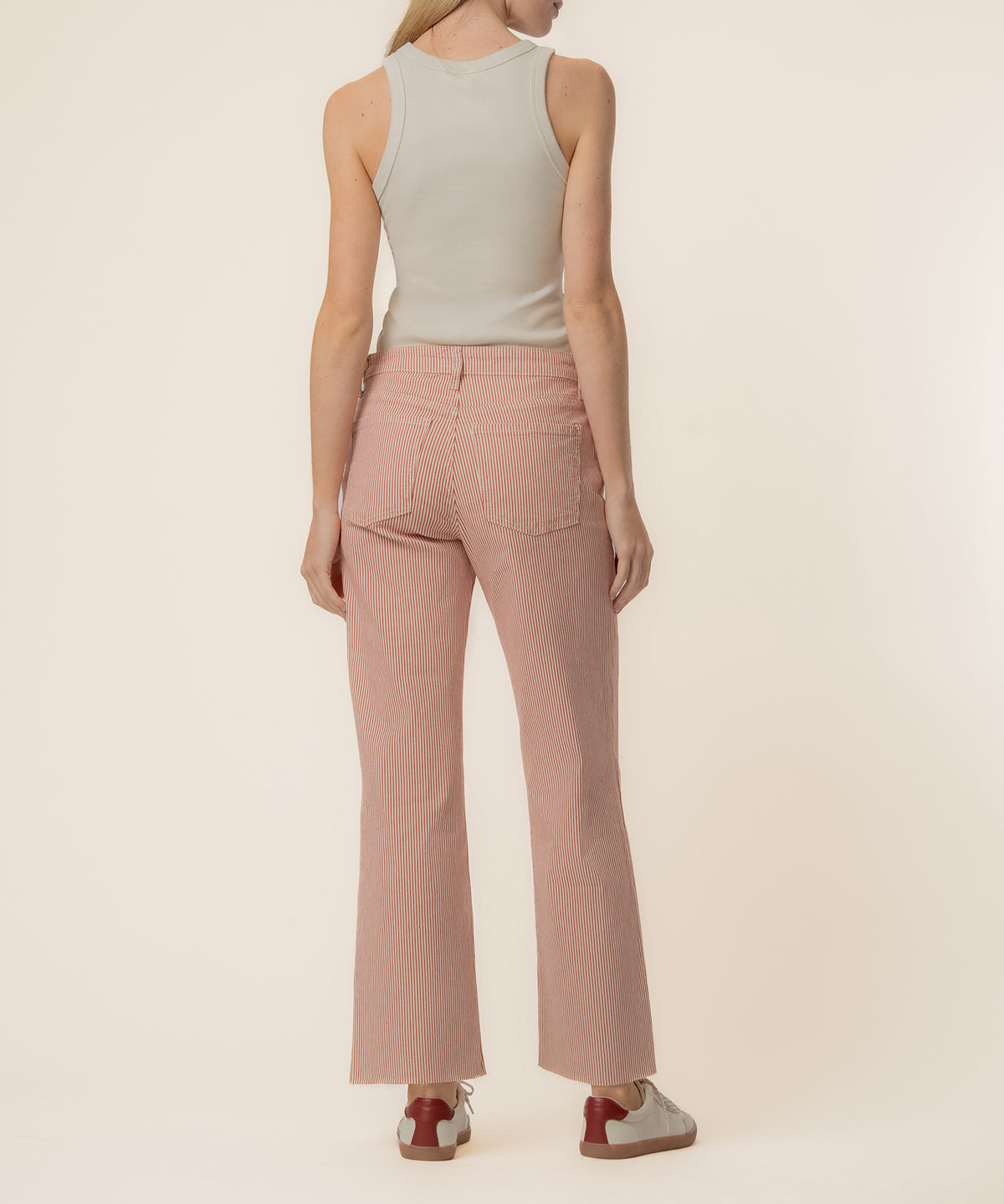 High-rise wide-leg jeans in red and ivory vertical stripes with five-pocket styling.