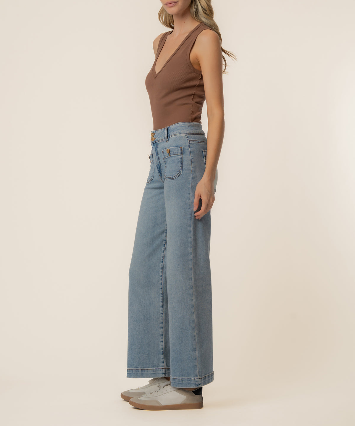 Light blue high-rise wide-leg jeans with a relaxed fit and visible stitching detail.