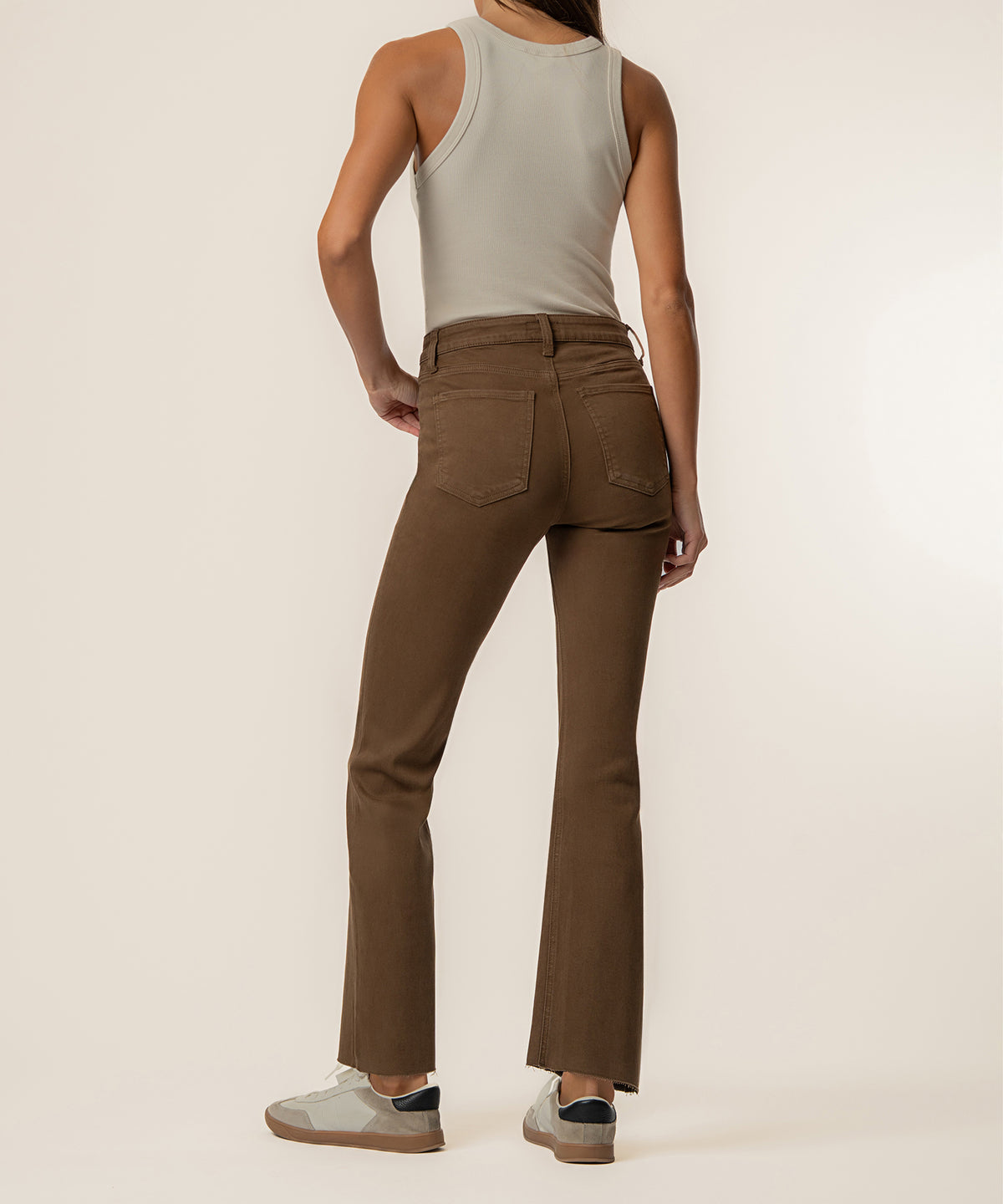 Pecan high-rise ankle flare jeans with five-pocket styling and flared legs, shown on model from waist down.