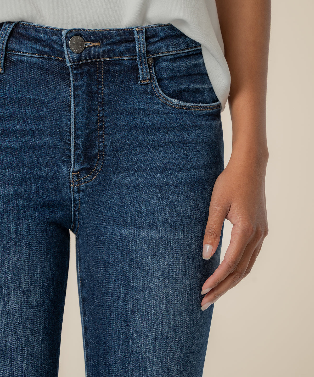 High-rise dark wash straight-leg ankle jeans with classic five-pocket styling and button closure.