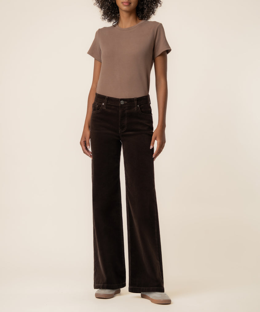 Brown corduroy high-rise wide-leg jeans with straight fit worn with a taupe t-shirt.