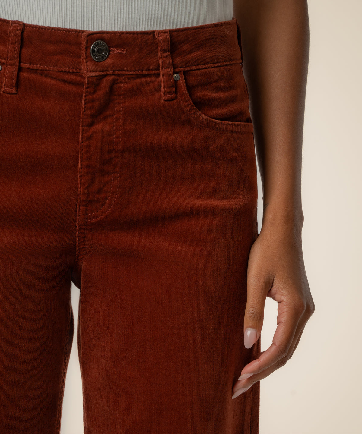 Sienna corduroy high-rise wide-leg pants with button fly and front pockets, shown on model.