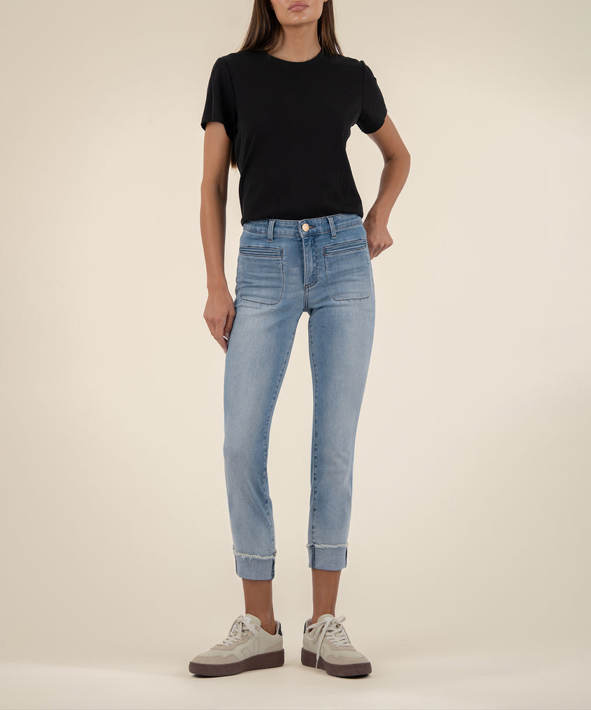 Light-wash straight-leg crop jeans with rolled cuffs, paired with a black short-sleeve t-shirt.