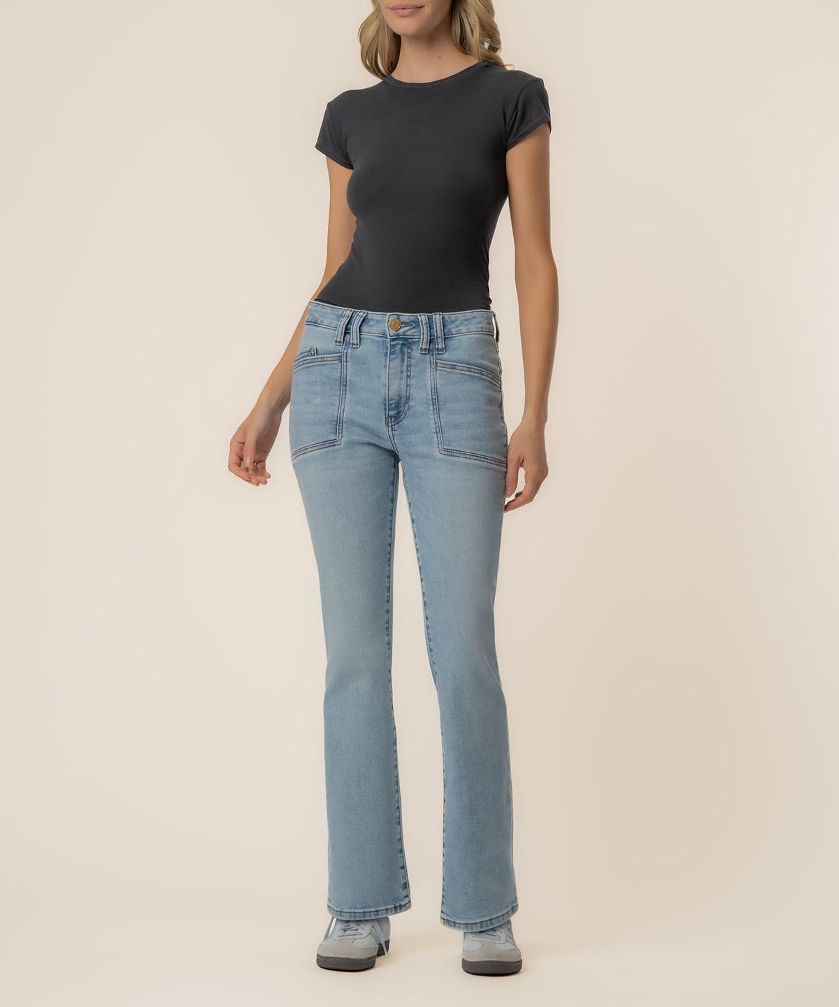 Light wash high-rise flare jeans with front seam detail paired with black short-sleeve t-shirt.