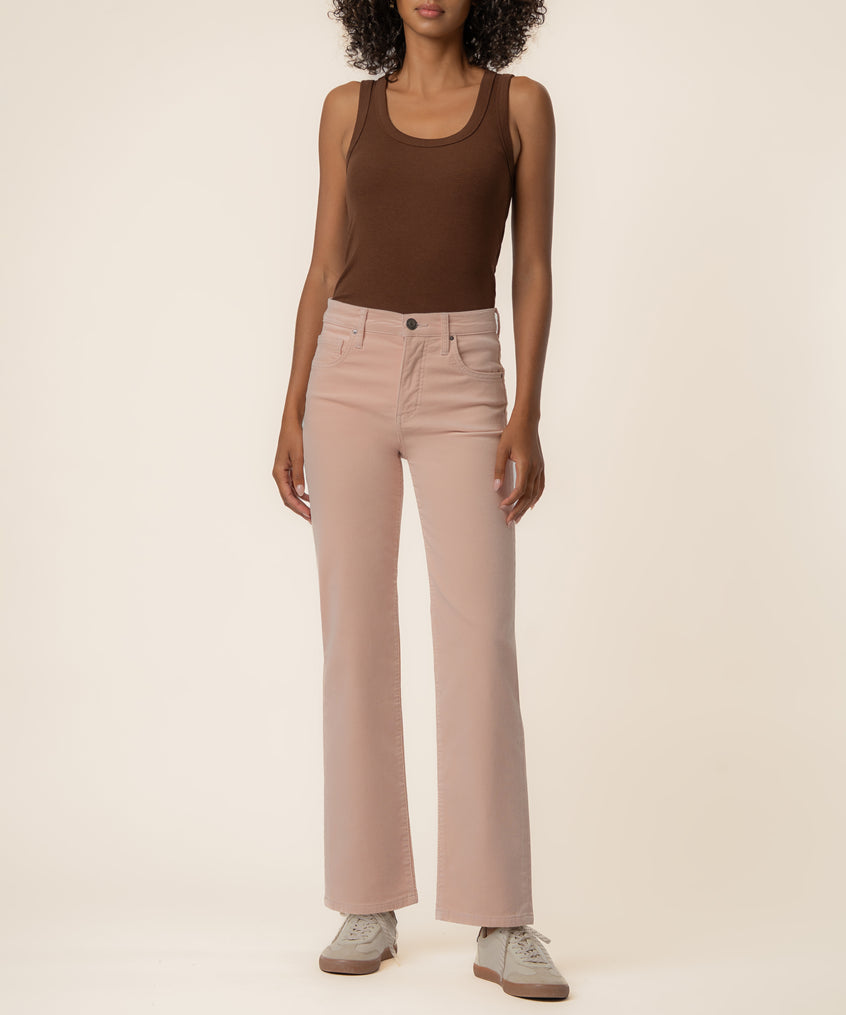 Pink corduroy high-rise straight-leg pants with button closure and front pockets styled with brown tank top.