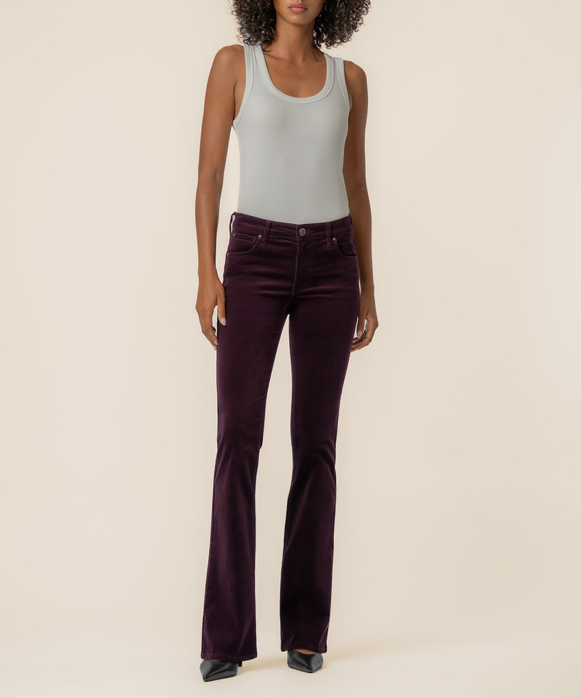 Eggplant corduroy bootcut pants with five-pocket styling worn with a light gray tank top.