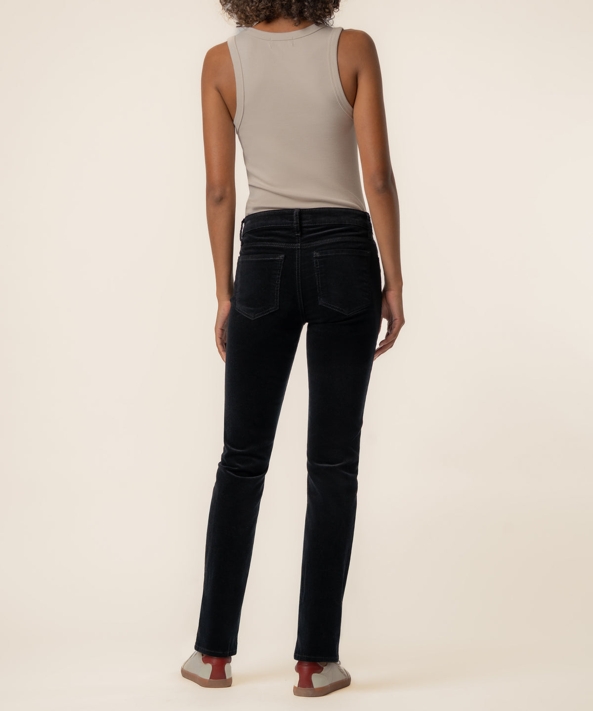Black corduroy mid-rise boyfriend jeans with five-pocket styling and visible stitching details on the back pockets.