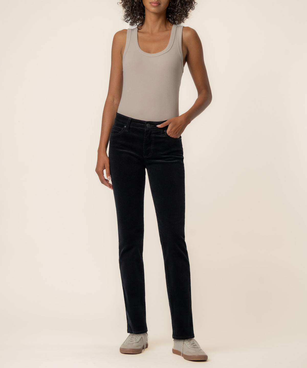 Black corduroy mid-rise boyfriend jeans with straight leg, styled with beige tank top.