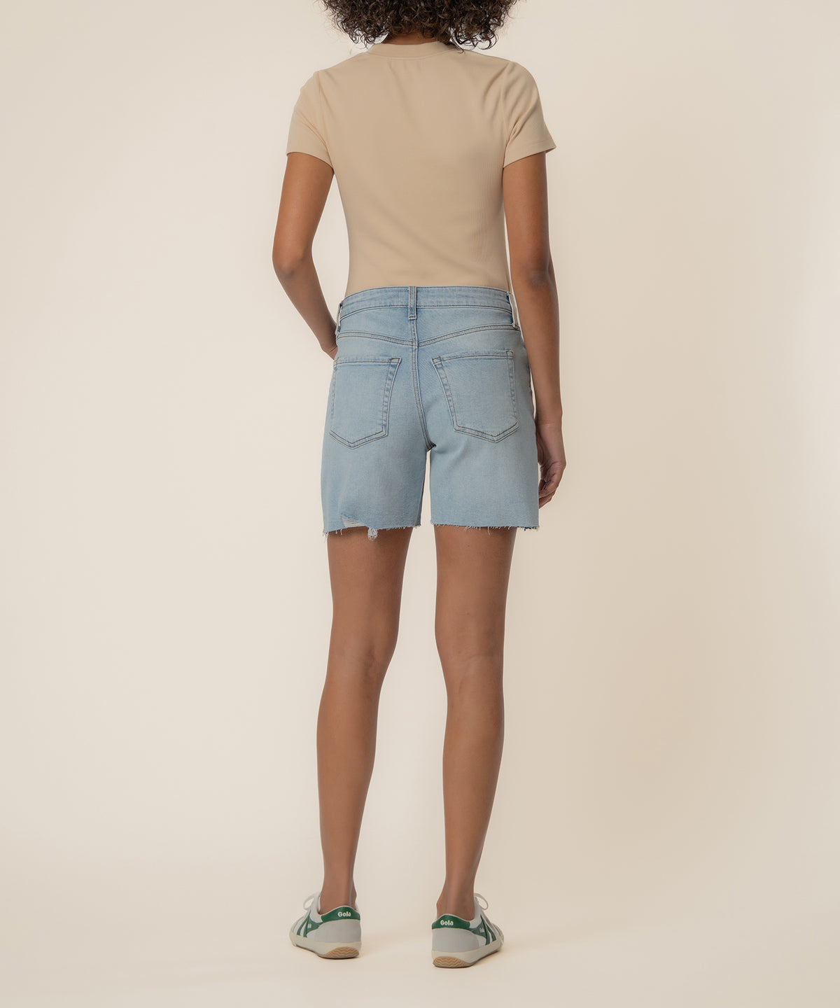 Light blue denim shorts with distressed hem and high rise waist, shown from back view.