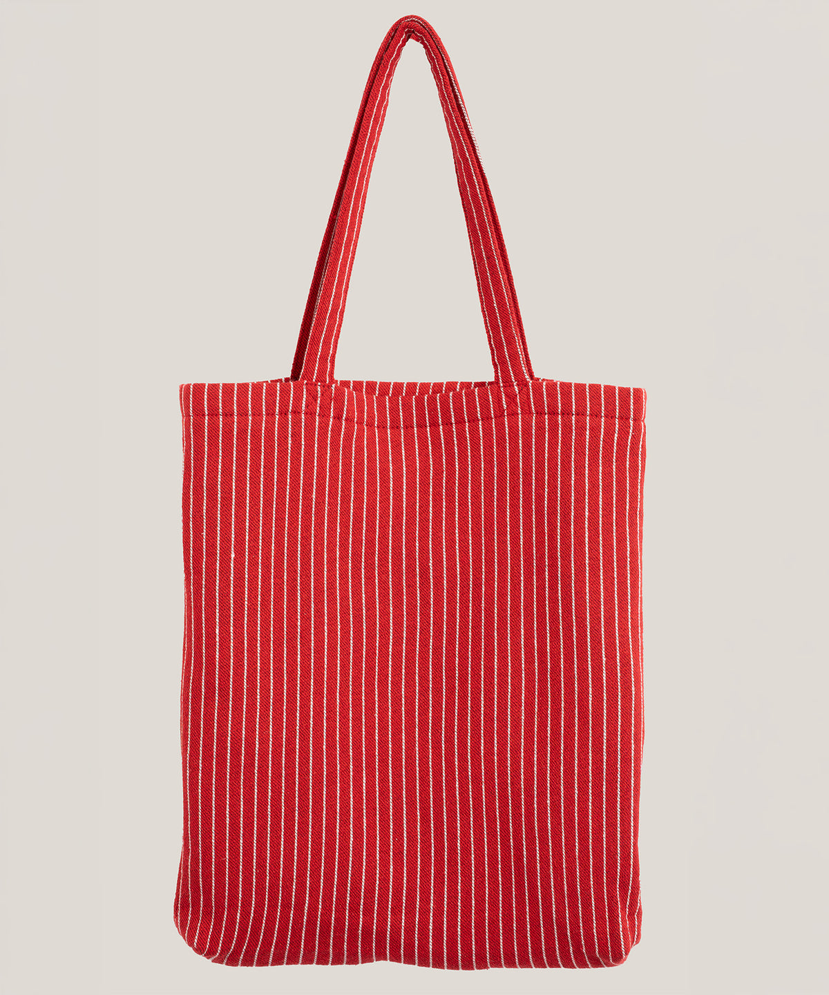 A red fabric tote bag with thin white vertical stripes and two long handles stands against a plain light background.